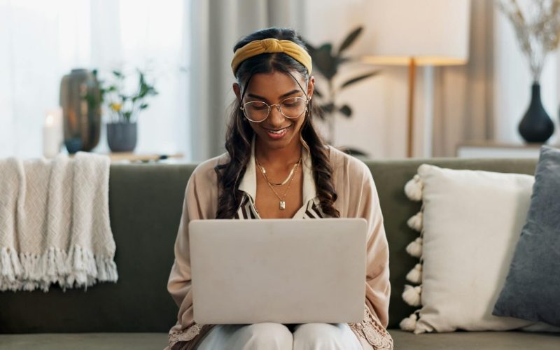 UI/UX Design - Betra Web laptop-remote-work-and-happy-woman-on-a-sofa-for-social-media-research-or-reading-a-home-tech-f.jpg
